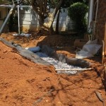 Thin layer of soil to cover the drain