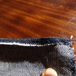 Fold over the zigzag edge to where the pin marks the width of the drawstring 'tube'